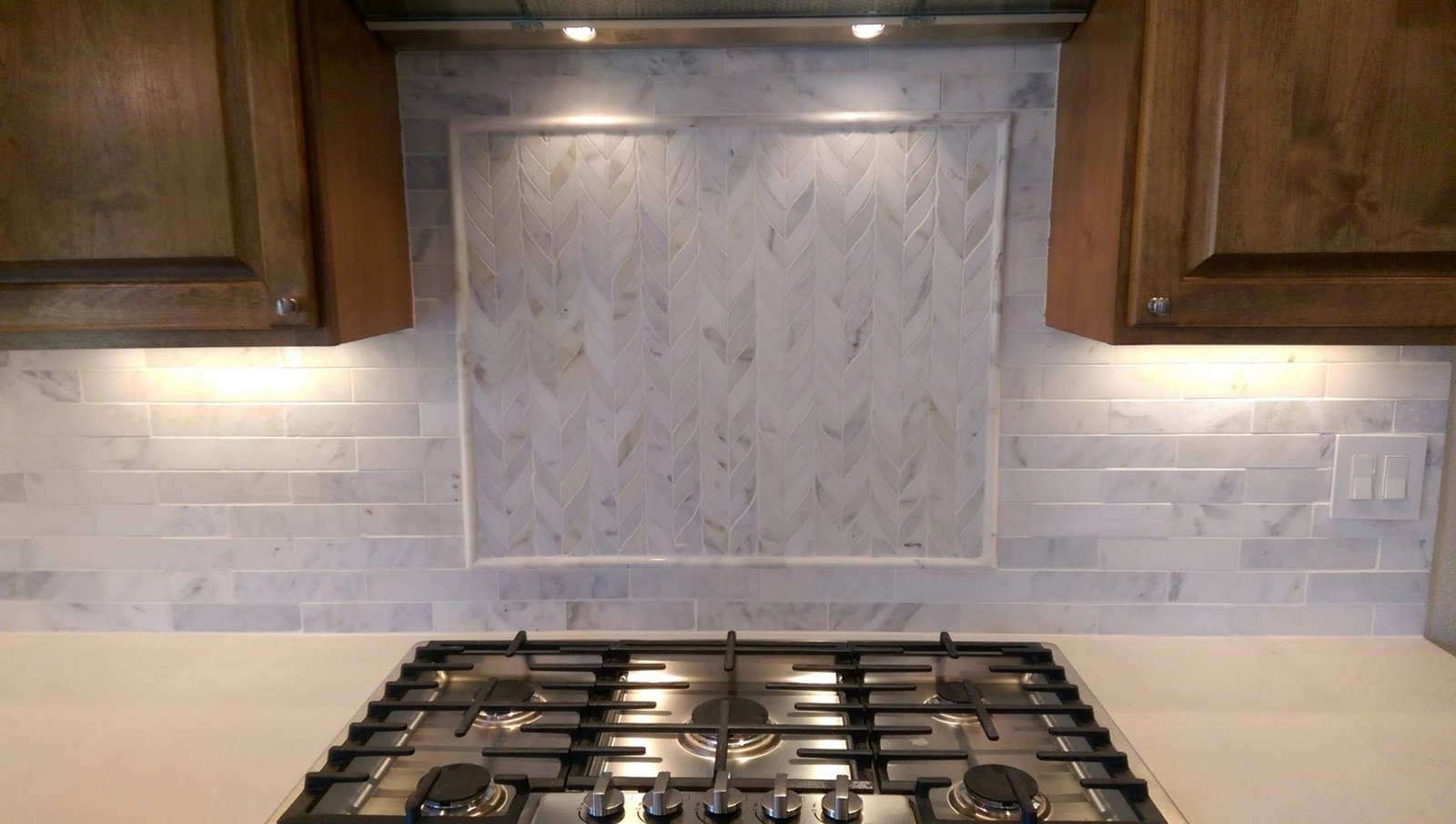 Marble Backsplash with Herringbone Accent